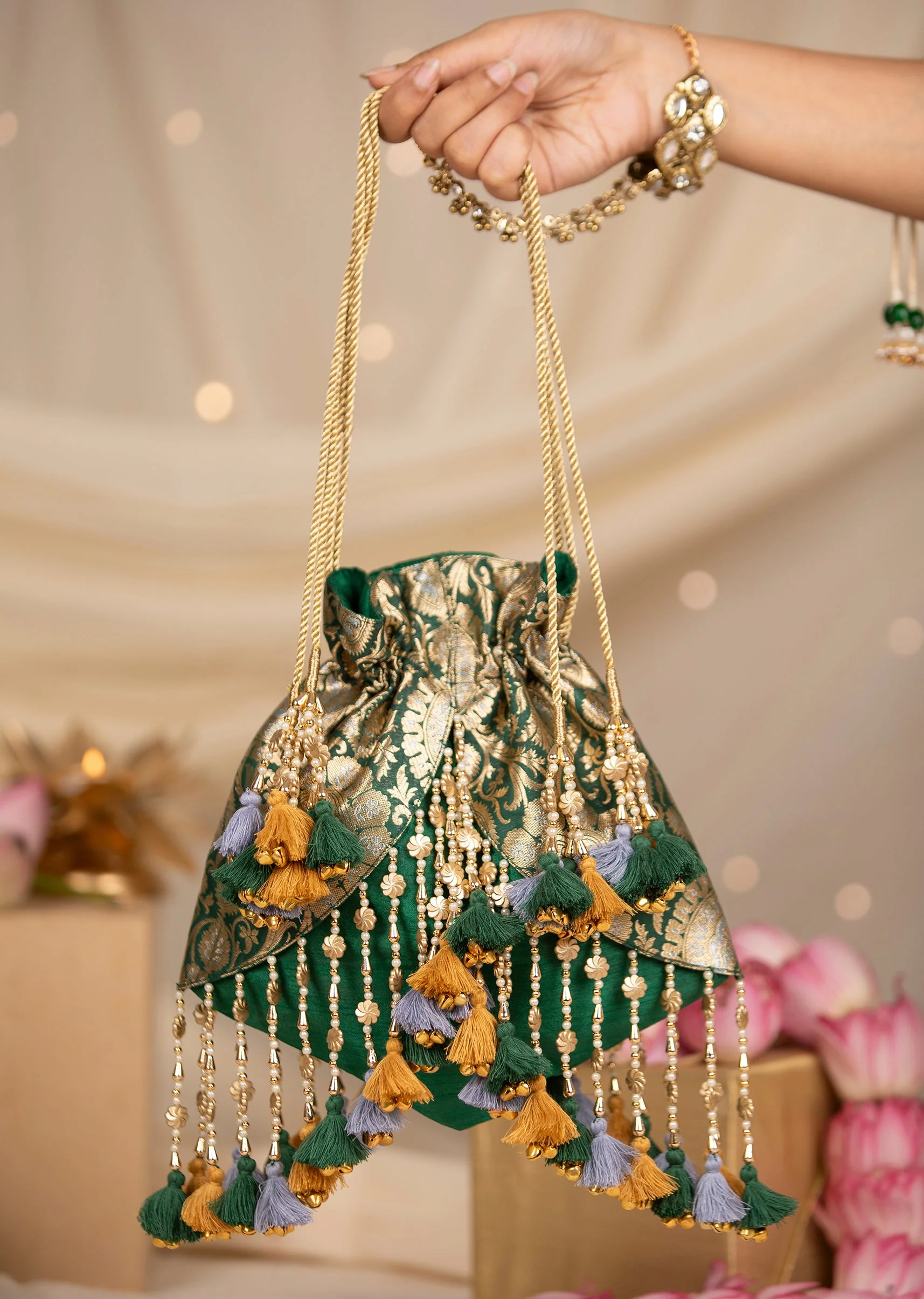 476-green-and-gold-embellished-tassel-potli-bag-1.webp Green and Gold Embellished Tassel Potli Bag