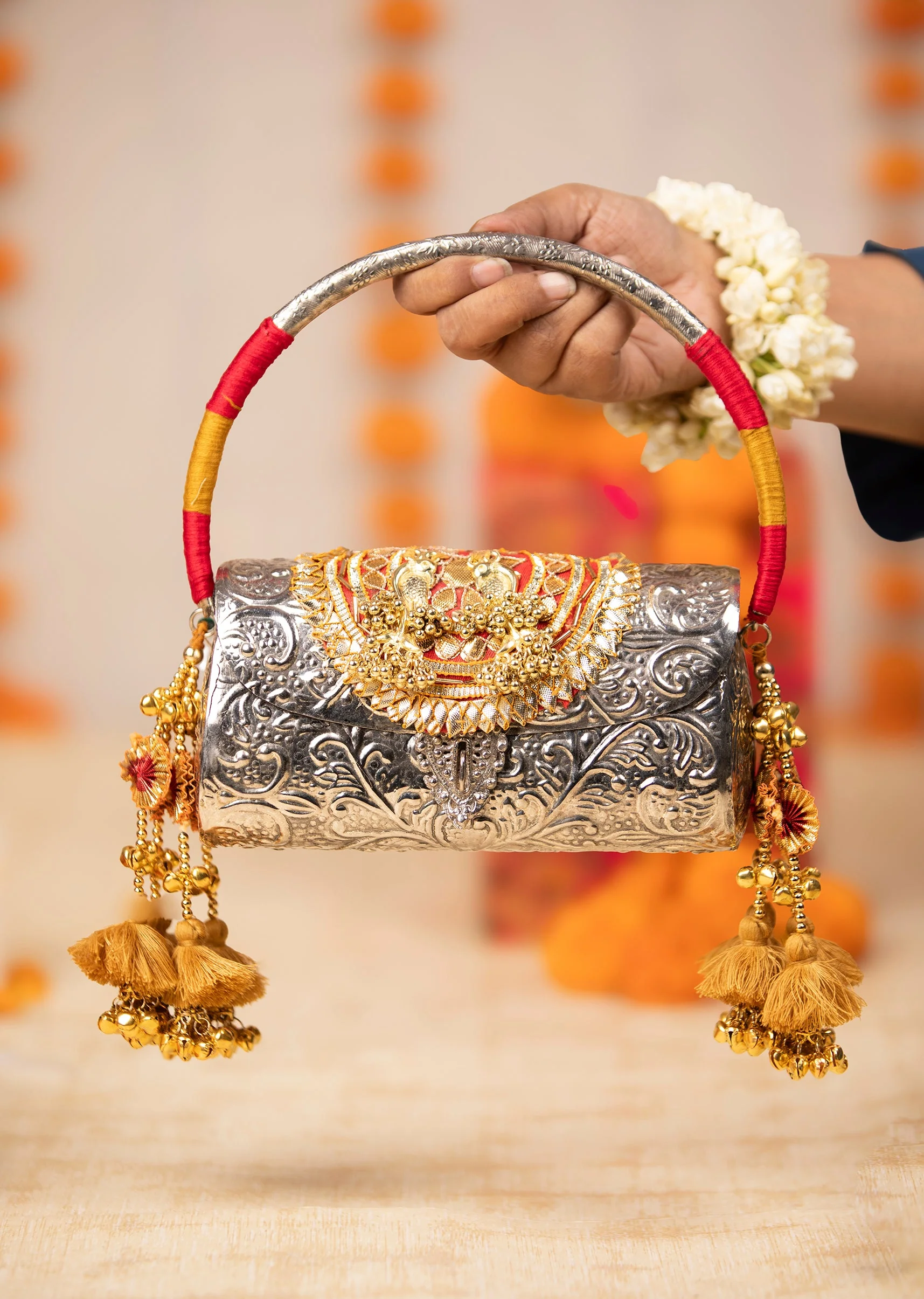 478-silver-and-gold-embossed-metal-bag-with-tassels-1.webp Silver and Gold Embossed Metal Bag with Tassels