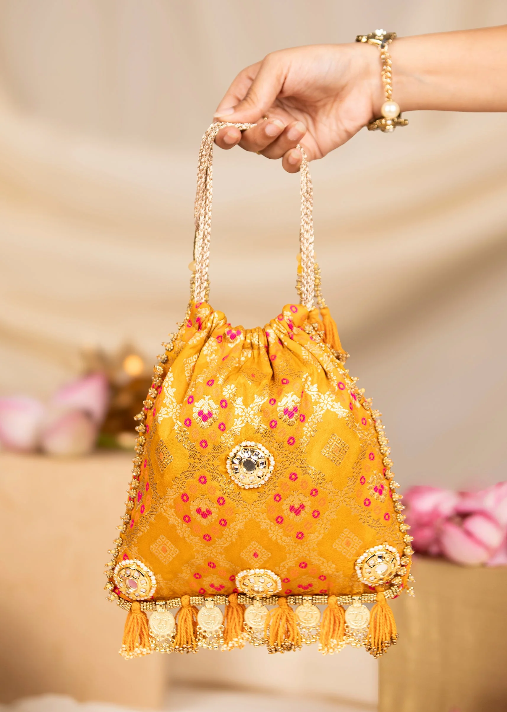 505-yellow-mirror-embellished-silk-potli-bag-1.webp Yellow Mirror Embellished Silk Potli Bag