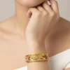 537-gold-finish-temple-style-bangle-with-rani-pink-and-green-simulated-stones-1.webp Gold Finish Temple Style Bangle With Rani Pink and Green Simulated Stones