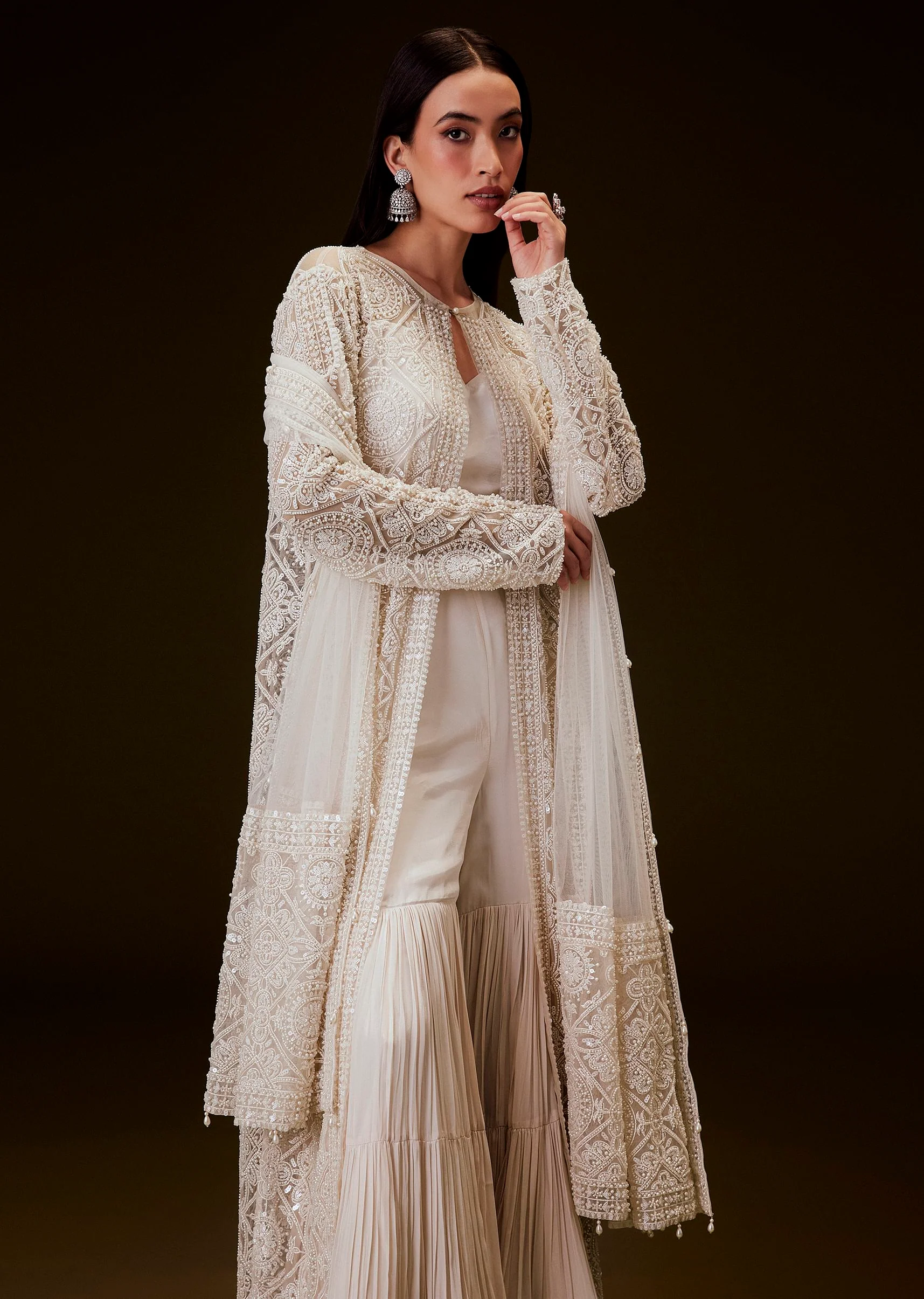 5386-peach-sharara-set-with-sequence-embroidered-long-jacket-1.webp Peach Sharara Set With Sequence Embroidered Long Jacket