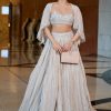 White Ruched Lehenga With Spaghetti Blouse And Cape