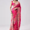 Rani Pink Woven Saree With Unstitched Blouse