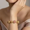 Gold Bangles With Floral Design And Ruby Diamond Stones