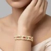 Gold Bangles With White Stones And Scalloped Design With Pink Accents