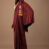 Blood Red Satin Saree With Fringes On The Pallu Paired With Hand Embroidered Bustier