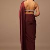 Blood Red Satin Saree With Fringes On The Pallu Paired With Hand Embroidered Bustier
