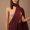 Blood Red Satin Saree With Fringes On The Pallu Paired With Hand Embroidered Bustier