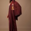 Blood Red Satin Saree With Fringes On The Pallu Paired With Hand Embroidered Bustier