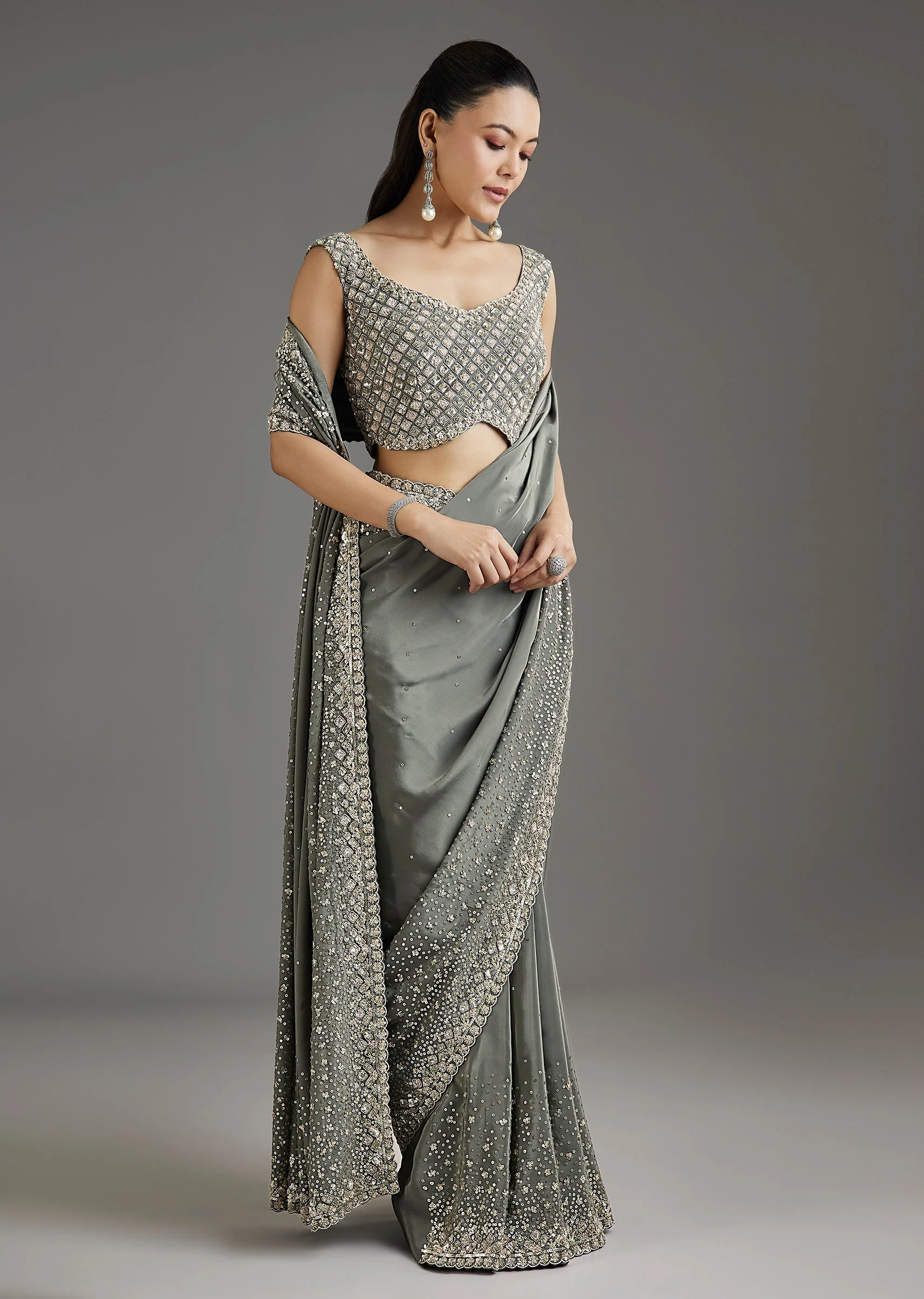 7177-grey-metallic-green-crepe-saree-with-embellished-border-1.webp Grey Metallic Green Crepe Saree With Embellished Border