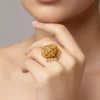 Gold Toned Ring With Temple Style Motifs