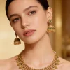 727-gold-finish-necklace-set-with-temple-style-motifs-and-green-simulated-stones-1.webp Gold Finish Necklace Set With Temple Style Motifs And Green Simulated Stones
