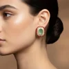736-gold-tone-earrings-in-stud-style-with-enamel-and-stone-detailing-1.webp Gold Tone Earrings In Stud Style With Enamel And Stone Detailing