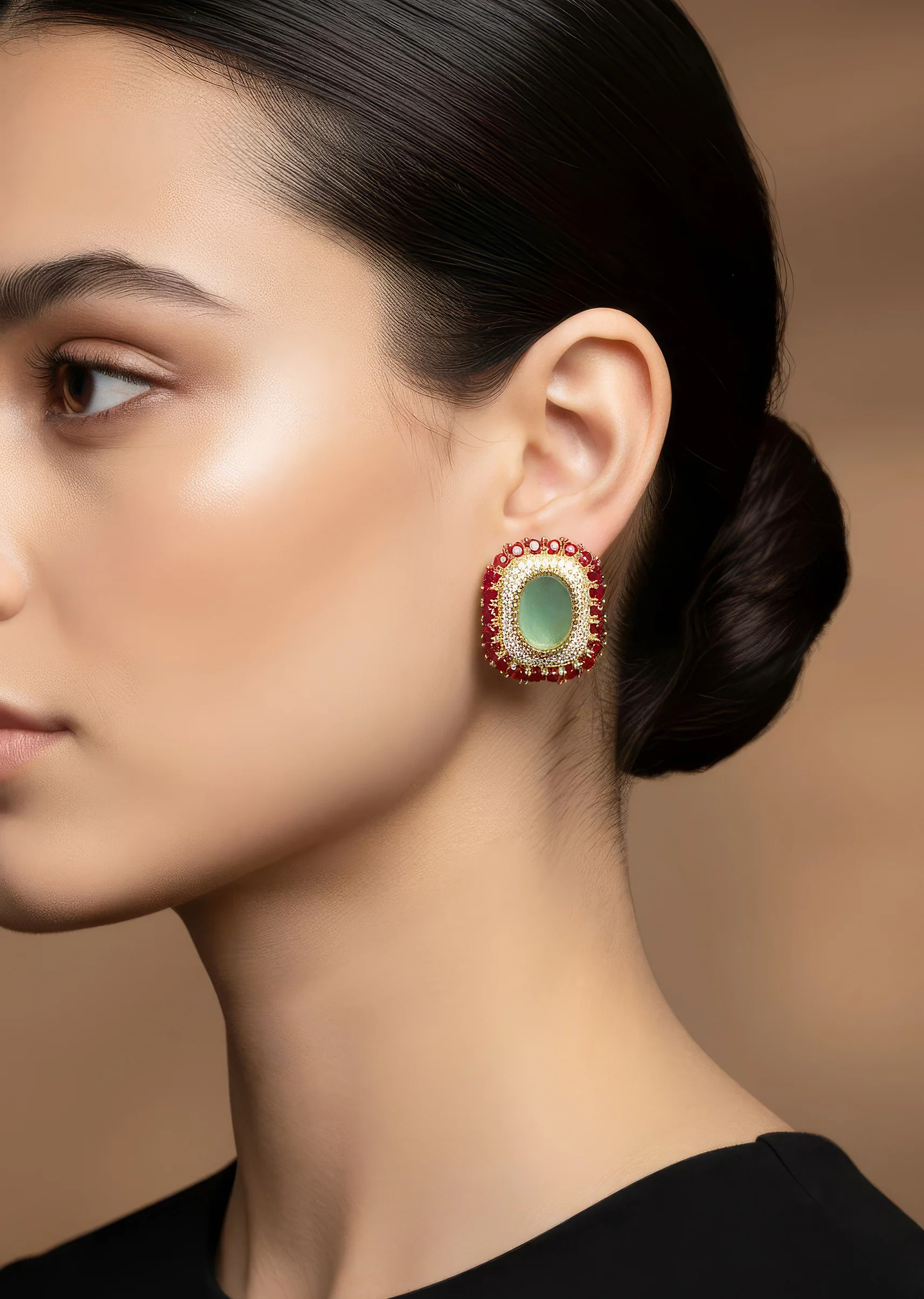736-gold-tone-earrings-in-stud-style-with-enamel-and-stone-detailing-1.webp Gold Tone Earrings In Stud Style With Enamel And Stone Detailing