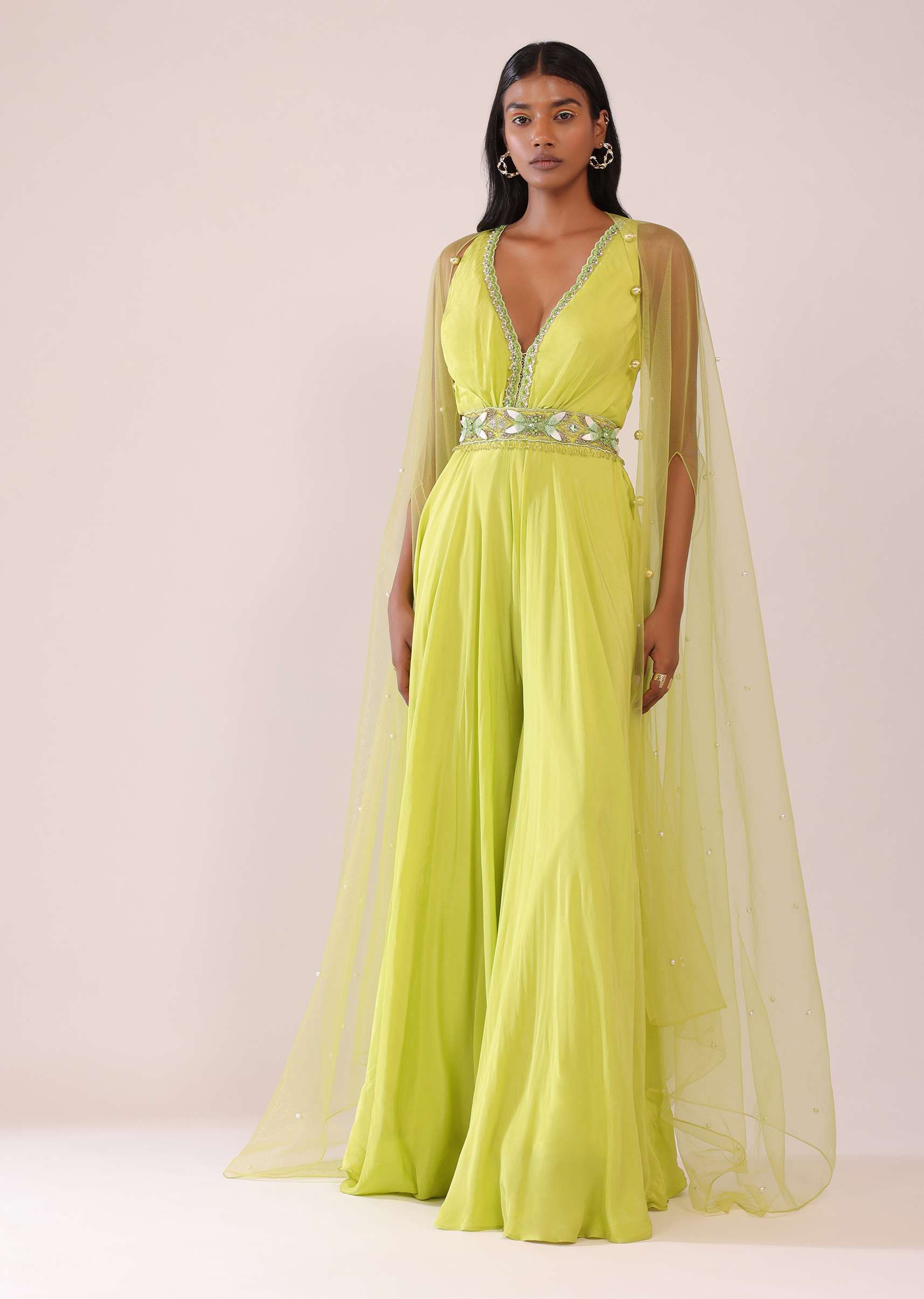 7872-sheen-green-crepe-jumpsuit-and-net-shrug-with-a-crystal-bead-embroidered-belt-1.jpg Sheen Green Crepe Jumpsuit And Net Shrug With A Crystal Bead Embroidered Belt