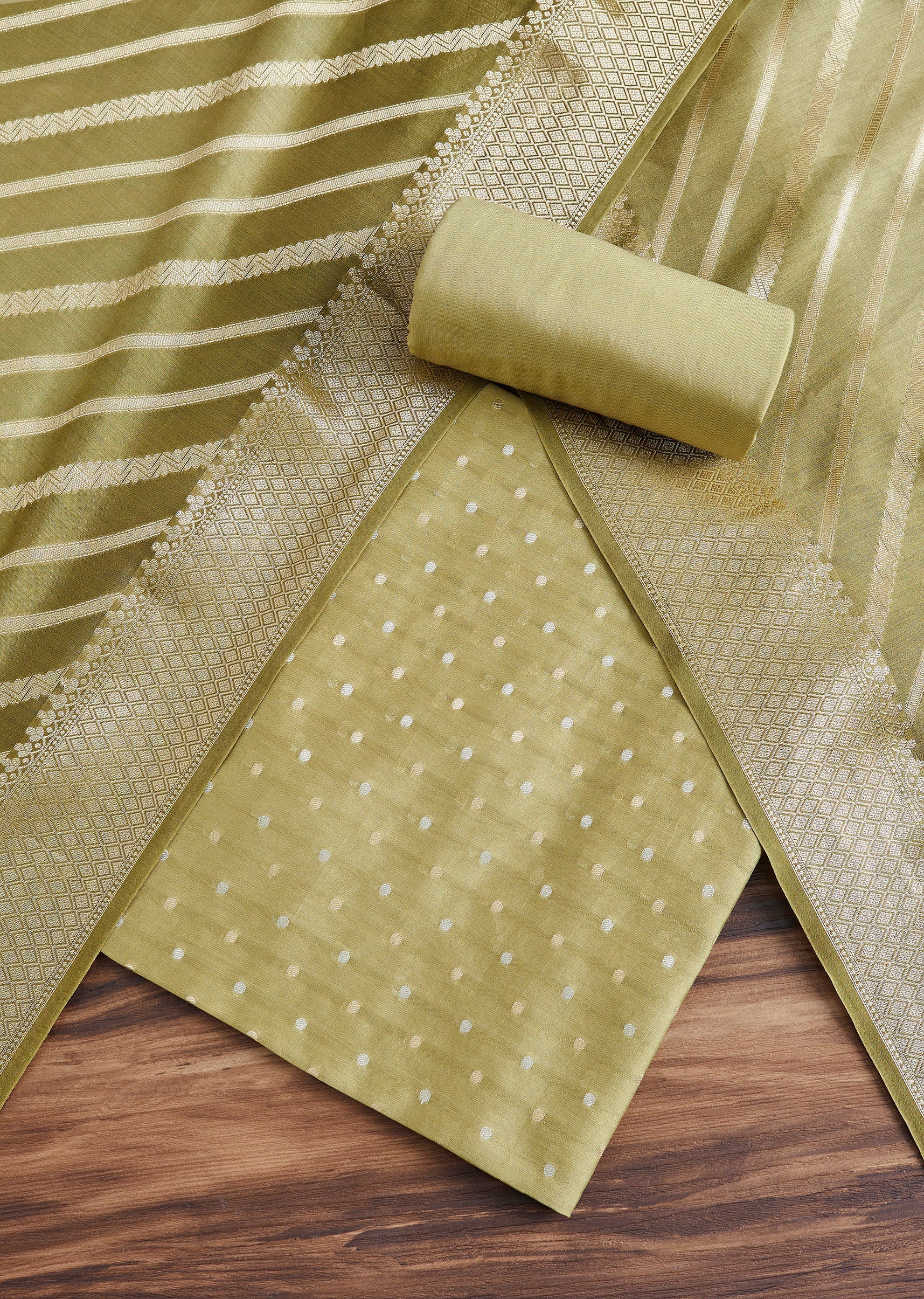 8181-green-chanderi-unstitched-suit-with-dupatta-1.jpg Green Chanderi Unstitched Suit With Dupatta