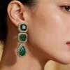 Green Stone Dangler Earrings Framed With Crystals