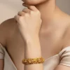 8434-gold-finish-bangle-with-traditional-temple-motifs-and-green-and-pink-simulated-stones-1.webp Gold Finish Bangle With Traditional Temple Motifs And Green and Pink Simulated Stones