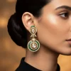 8442-gold-finish-dual-circular-earrings-with-green-baguette-cut-stone-borders-and-clear-polki-style-centers-1.webp Gold Finish Dual Circular Earrings With Green Baguette Cut Stone Borders And Clear Polki Style Centers