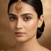 8445-gold-finish-maangtikka-with-temple-style-motifs-and-light-pink-dark-pink-and-green-simulated-stones-1.webp Gold Finish Maangtikka With Temple Style Motifs And Light Pink Dark Pink and Green Simulated Stones