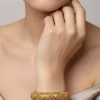 8454-gold-finish-temple-style-bangles-with-rani-pink-simulated-stones-and-zirconia-accents-1.webp Gold Finish Temple Style Bangles With Rani Pink Simulated Stones And Zirconia Accents