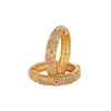 8454-gold-finish-temple-style-bangles-with-rani-pink-simulated-stones-and-zirconia-accents-2.webp Gold Finish Temple Style Bangles With Rani Pink Simulated Stones And Zirconia Accents