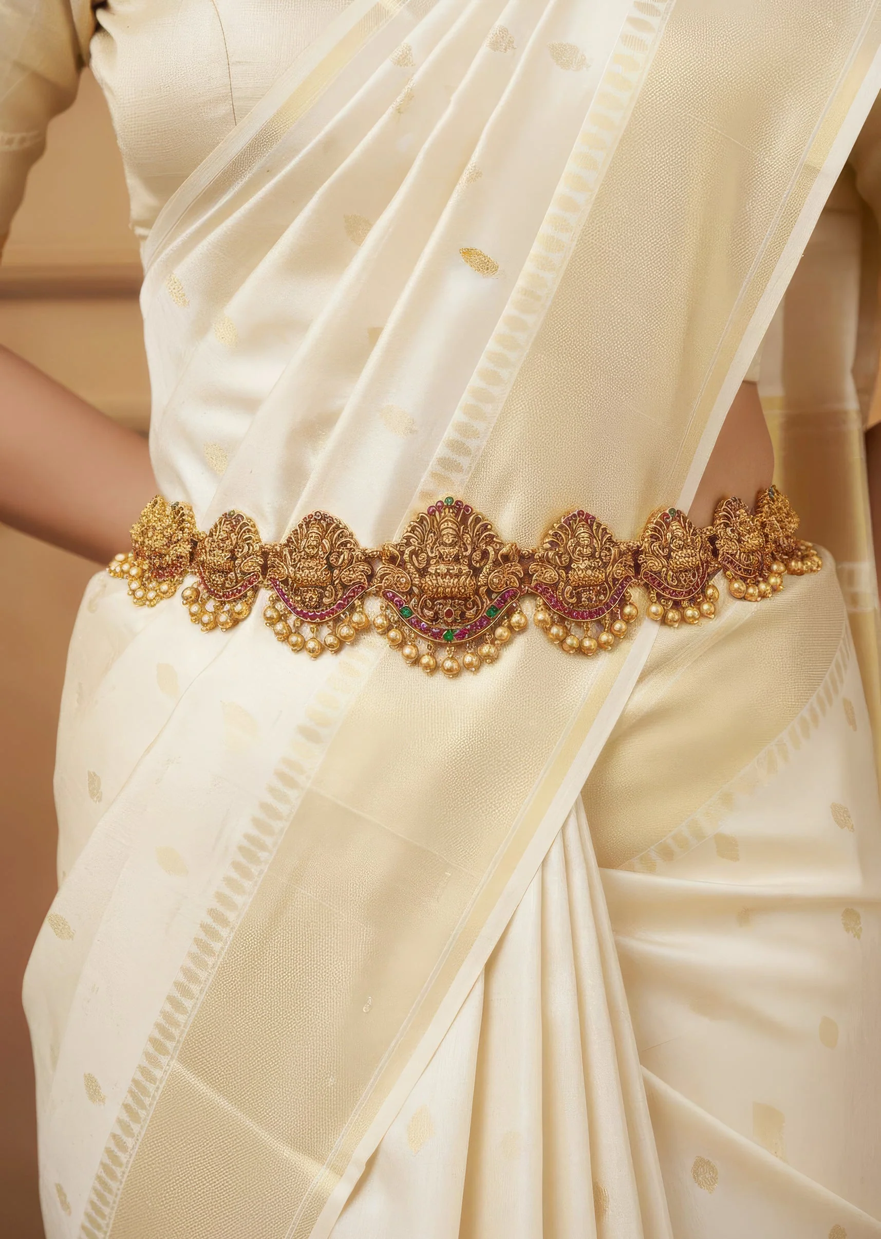 8479-gold-finish-waist-belt-with-temple-style-motif-and-pink-and-green-simulated-stone-1.webp Gold Finish Waist Belt With Temple Style Motif And Pink and Green Simulated Stone