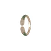 Gold Finish Bracelet In Mix Metal With Modern Cuff Style And Green Simulated Emerald And Cubic Zirconia Accents