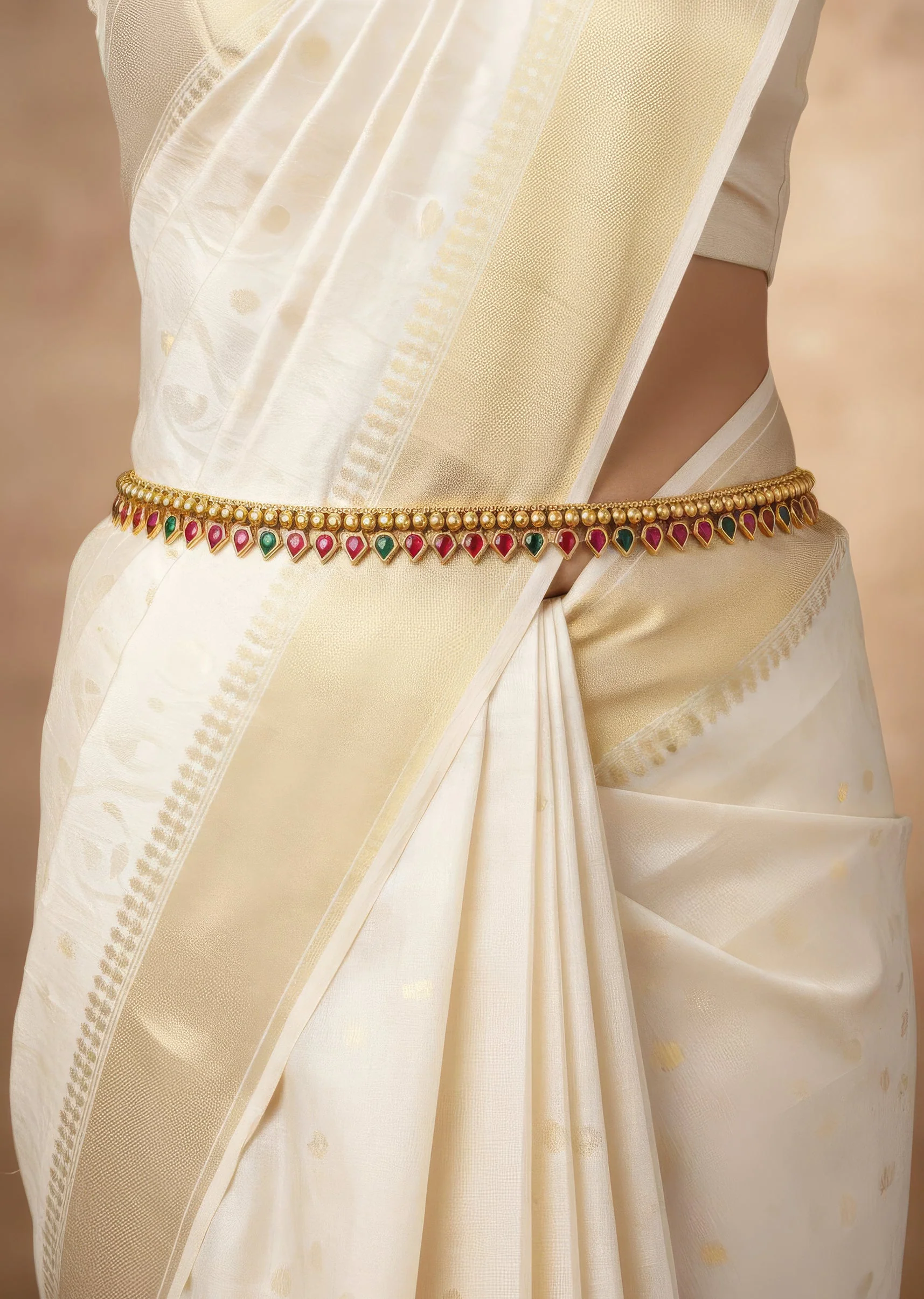 8486-gold-finish-waist-belt-with-temple-style-motifs-and-pink-and-green-simulated-stones-1.webp Gold Finish Waist Belt With Temple Style Motifs And Pink and Green Simulated Stones