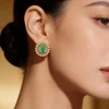 8506-gold-finish-circular-stud-earrings-with-large-green-center-stone-and-polki-style-halo-1.webp Gold Finish Circular Stud Earrings With Large Green Center Stone and Polki Style Halo