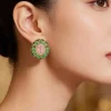 8508-gold-finish-ornate-cabochon-stud-earrings-with-pink-oval-center-and-green-and-clear-stone-halos-1.webp Gold Finish Ornate Cabochon Stud Earrings With Pink Oval Center and Green and Clear Stone Halos