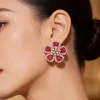 8509-silver-finish-floral-cluster-stud-earrings-with-red-simulated-mystery-set-stones-and-clear-accents-1.webp Silver Finish Floral Cluster Stud Earrings With Red Simulated Mystery Set Stones and Clear Accents