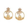 8514-gold-finish-statement-earrings-with-floral-vine-motif-in-white-kundan-and-ornate-filigree-work-2.webp Gold Finish Statement Earrings With Floral Vine Motif In White Kundan And Ornate Filigree Work