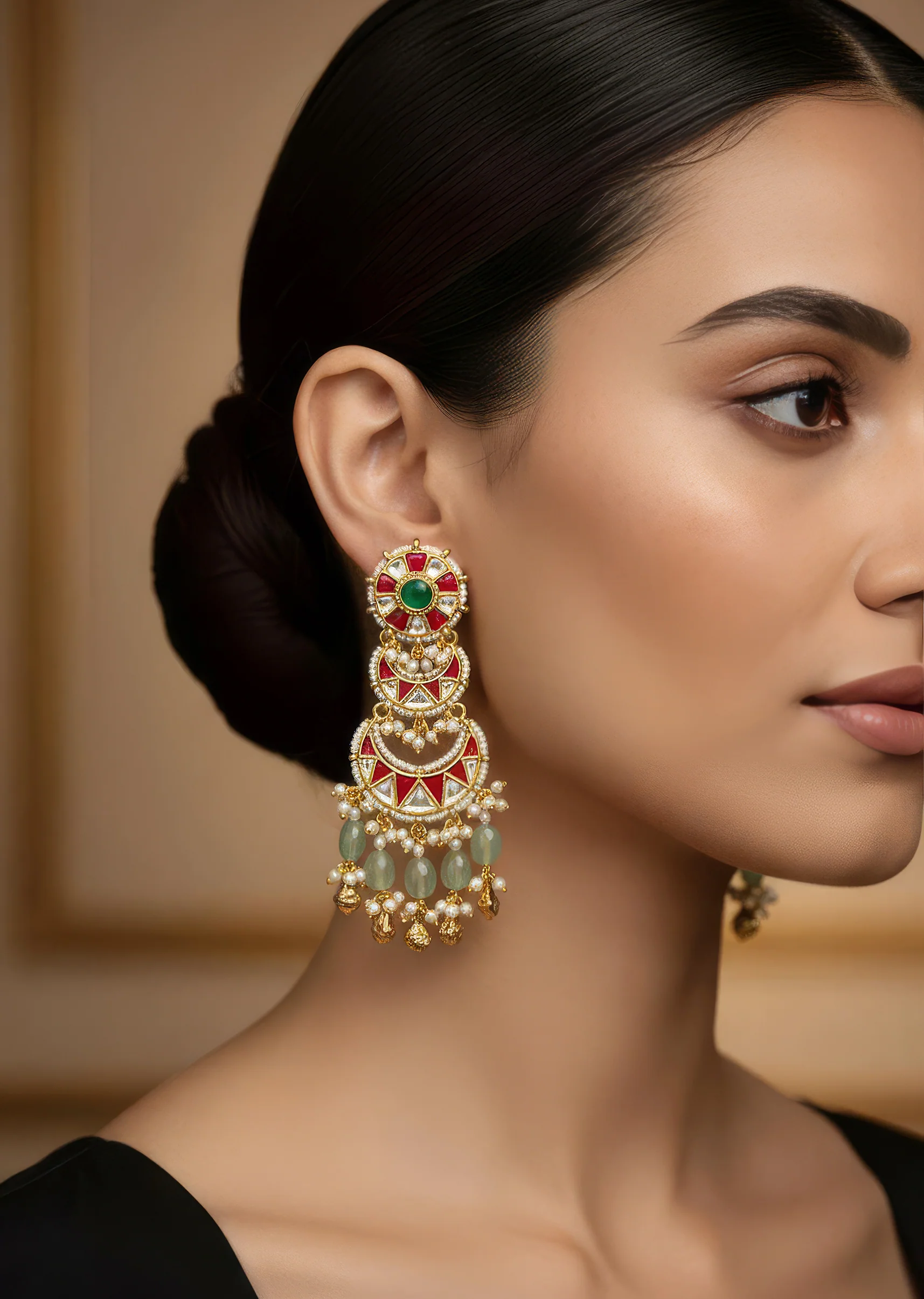 8518-gold-finish-three-tiered-chandbali-earrings-with-kundan-work-red-enamel-accents-moti-beads-and-green-hanging-stones-1.webp Gold Finish Three Tiered Chandbali Earrings With Kundan Work Red Enamel Accents Moti Beads And Green Hanging Stones