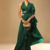 Emerald Green Ready Pleated Ruffle Saree With A Halter Neck Blouse And 3D Embroidered Belt