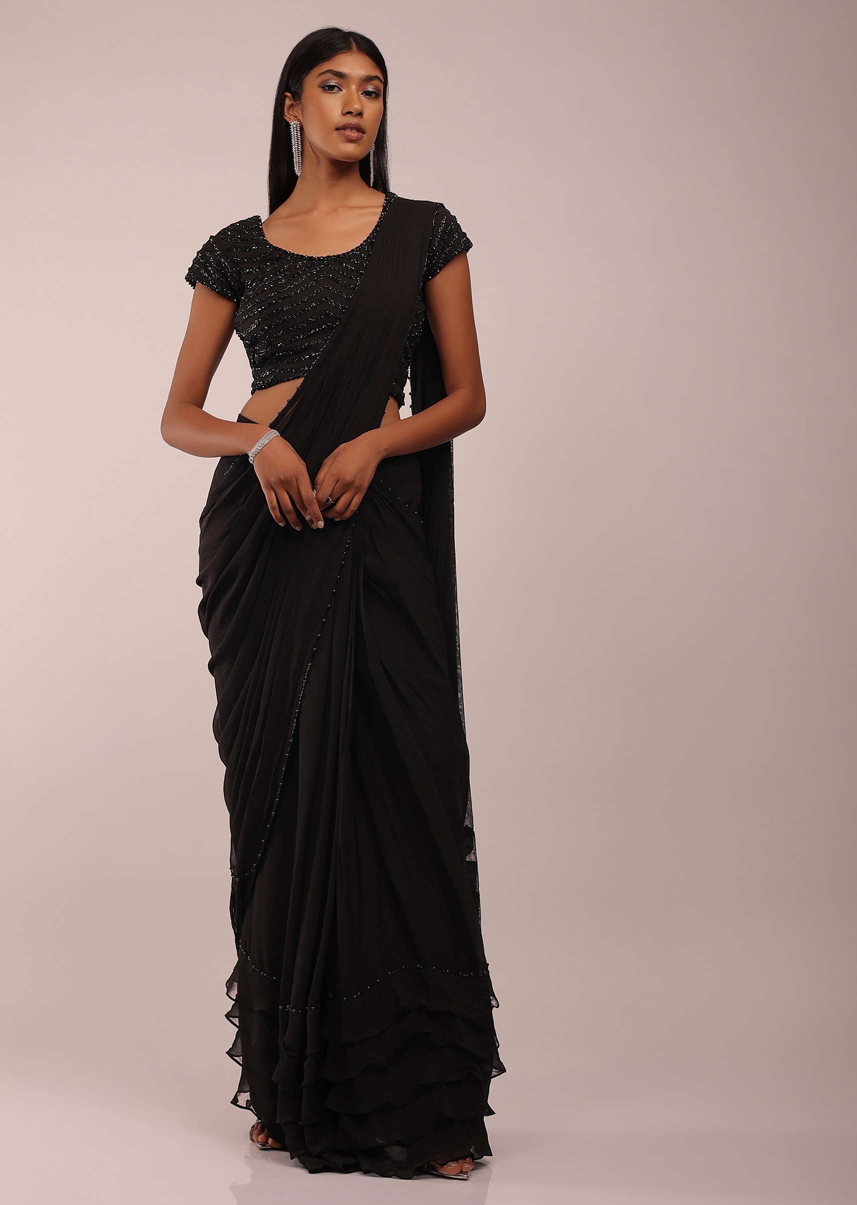 8678-us-12-us-12-variation-3.jpg Pitch Black Saree With Three Tones Of Layered Frills On The Bottom Embellished In Stones And Sequins With A Tassel On The Pallu Corner