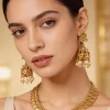 891-gold-finish-necklace-set-with-temple-style-motifs-and-off-white-simulated-stones-1.webp Gold Finish Necklace Set With Temple Style Motifs And Off White Simulated Stones