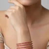 Gold Finish Bangle With Traditional Temple Motifs And Ruby Simulated Stones