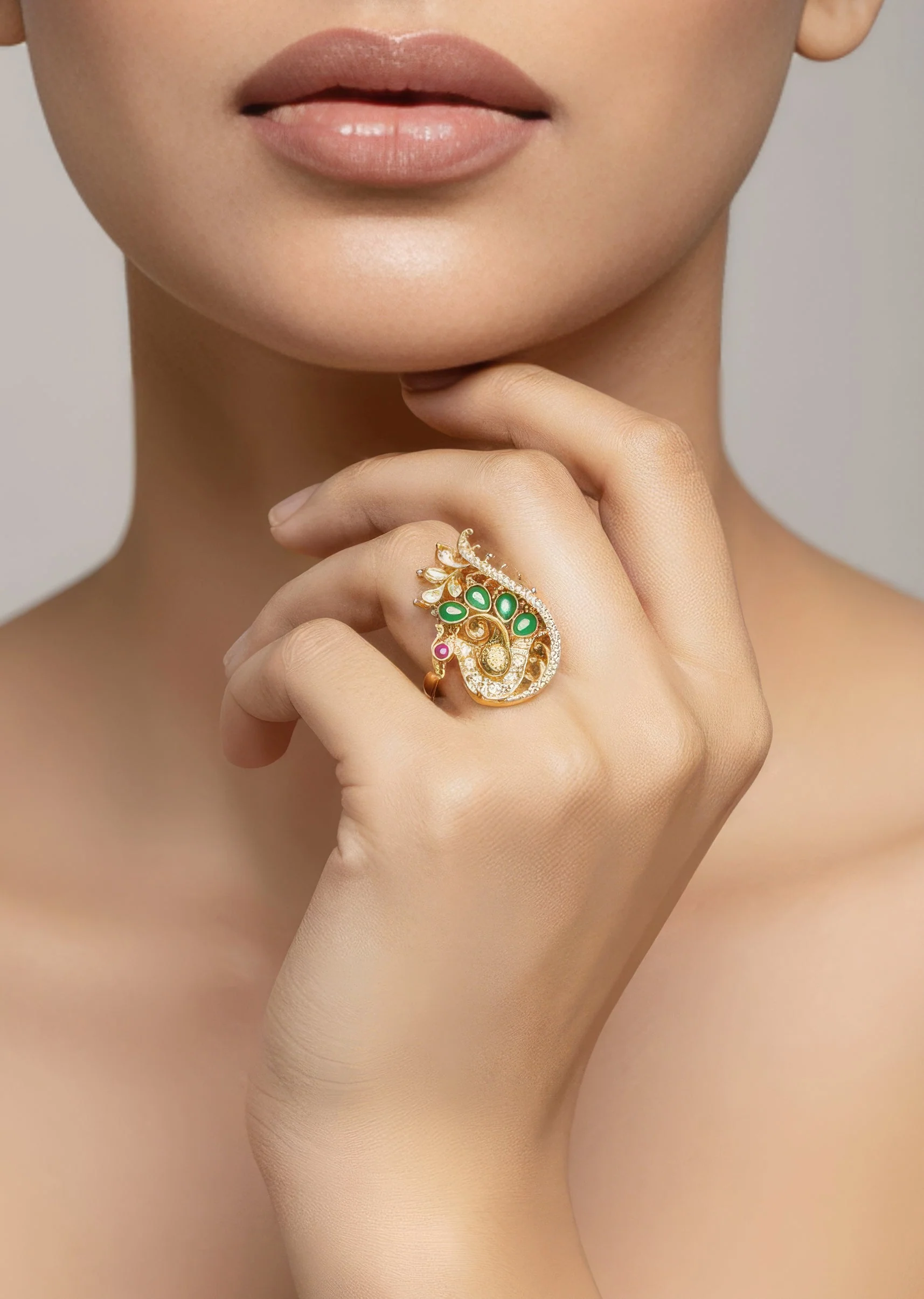 899-gold-finish-ring-with-temple-style-motifs-and-pink-and-green-simulated-stones-1.webp Gold Finish Ring With Temple Style Motifs And Pink and Green Simulated Stones