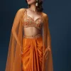 Rust Dhoti Skirt Set With Embellished Blouse And Tassel Net Dupatta