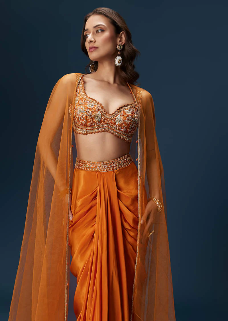 Rust Dhoti Skirt Set With Embellished Blouse And Tassel Net Dupatta