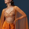 Rust Dhoti Skirt Set With Embellished Blouse And Tassel Net Dupatta