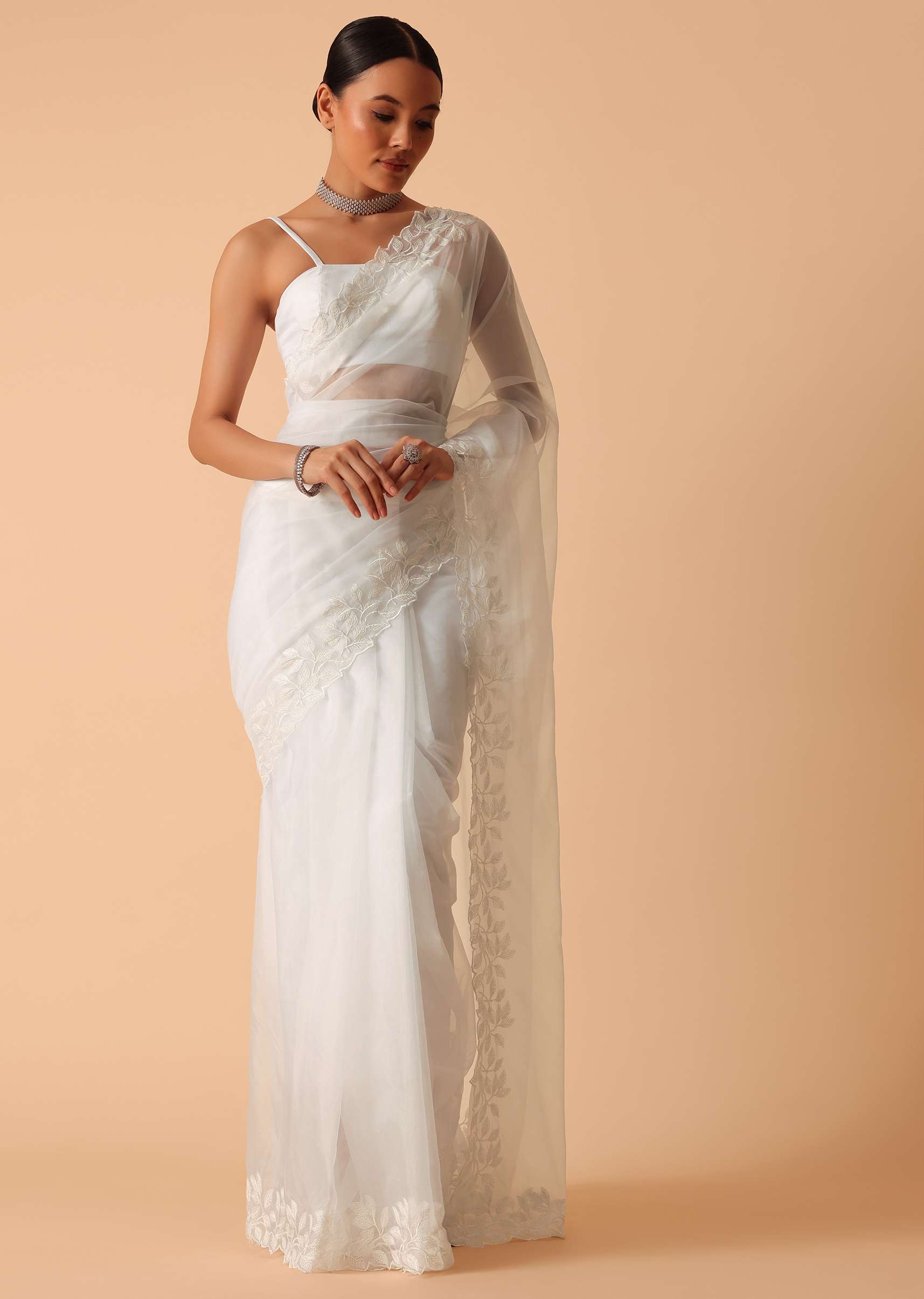 9182-white-saree-in-organza-with-floral-motif-border-and-unstitched-blouse-piece-1.jpg White Saree In Organza With Floral Motif Border And Unstitched Blouse Piece
