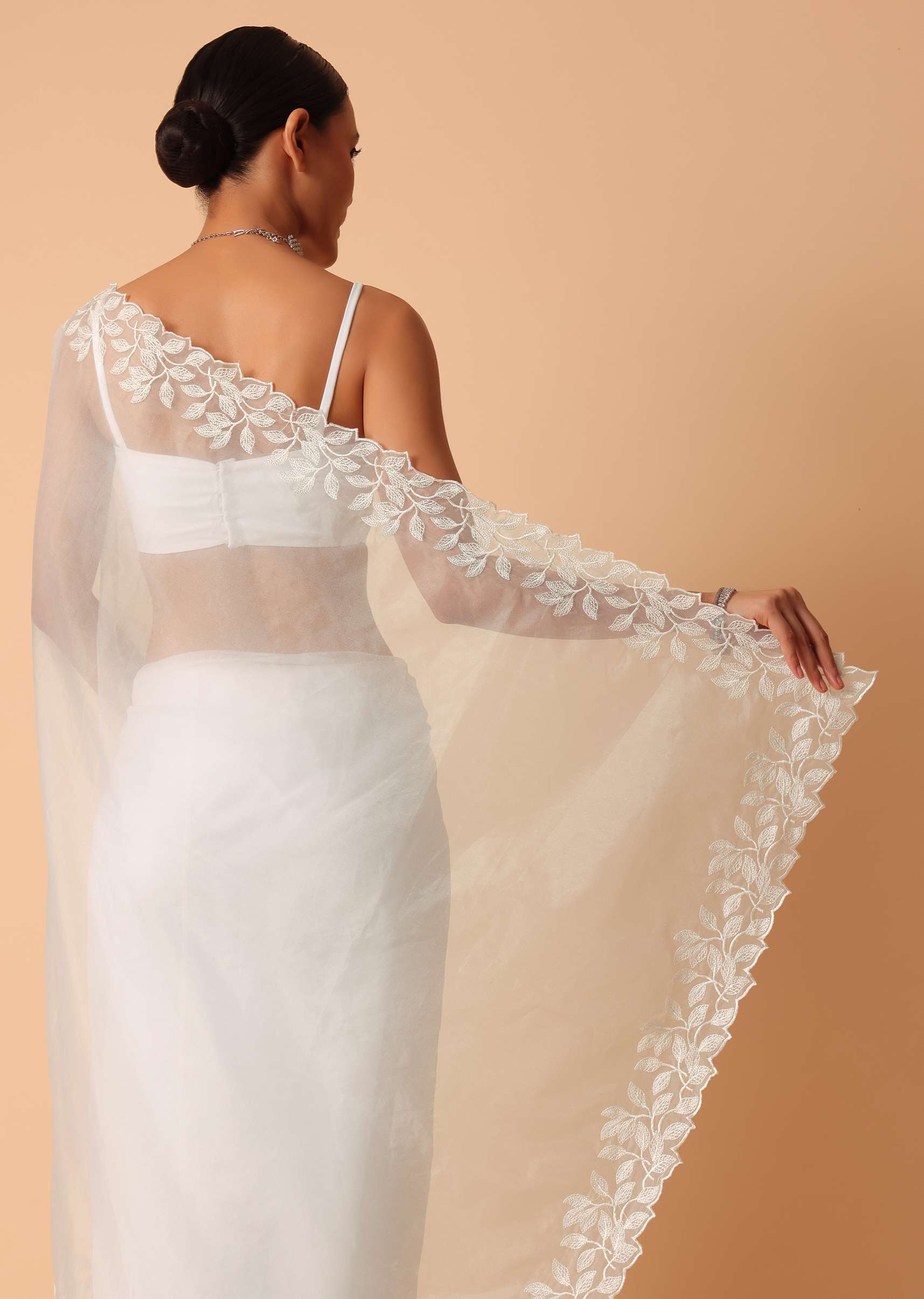 White Saree In Organza With Floral Motif Border And Unstitched Blouse Piece