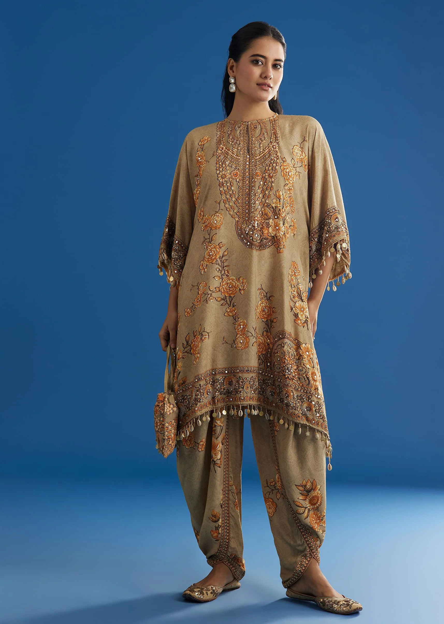 9316-beige-floral-printed-kaftan-dhoti-set-with-shells-and-metal-coin-tassels-1.webp Beige Floral Printed Kaftan Dhoti Set With Shells And Metal Coin Tassels