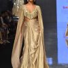 Mocha Brown Gown With A Pre-Pleated Dhoti Skirt And Royal Cape Sleeves - NOOR 2022