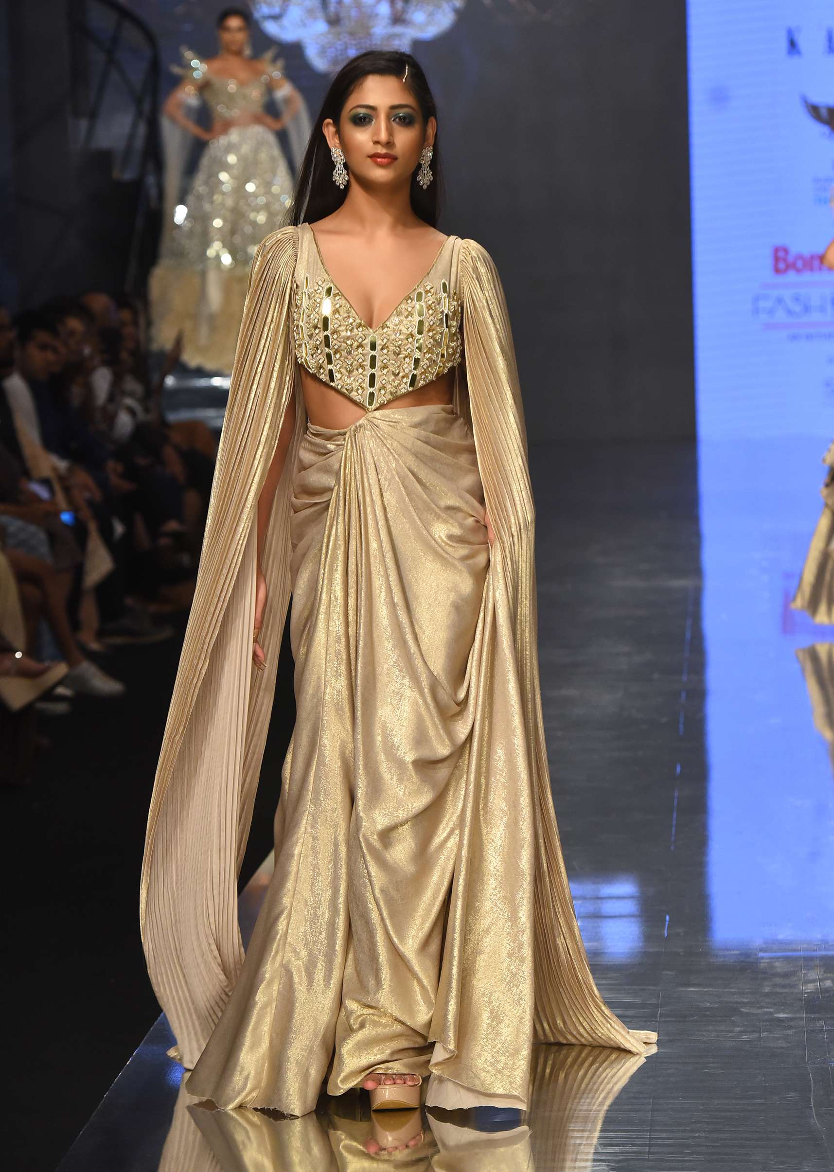 9461-mocha-brown-gown-with-a-pre-pleated-dhoti-skirt-and-royal-cape-sleeves-noor-2022-1.jpg Mocha Brown Gown With A Pre-Pleated Dhoti Skirt And Royal Cape Sleeves - NOOR 2022