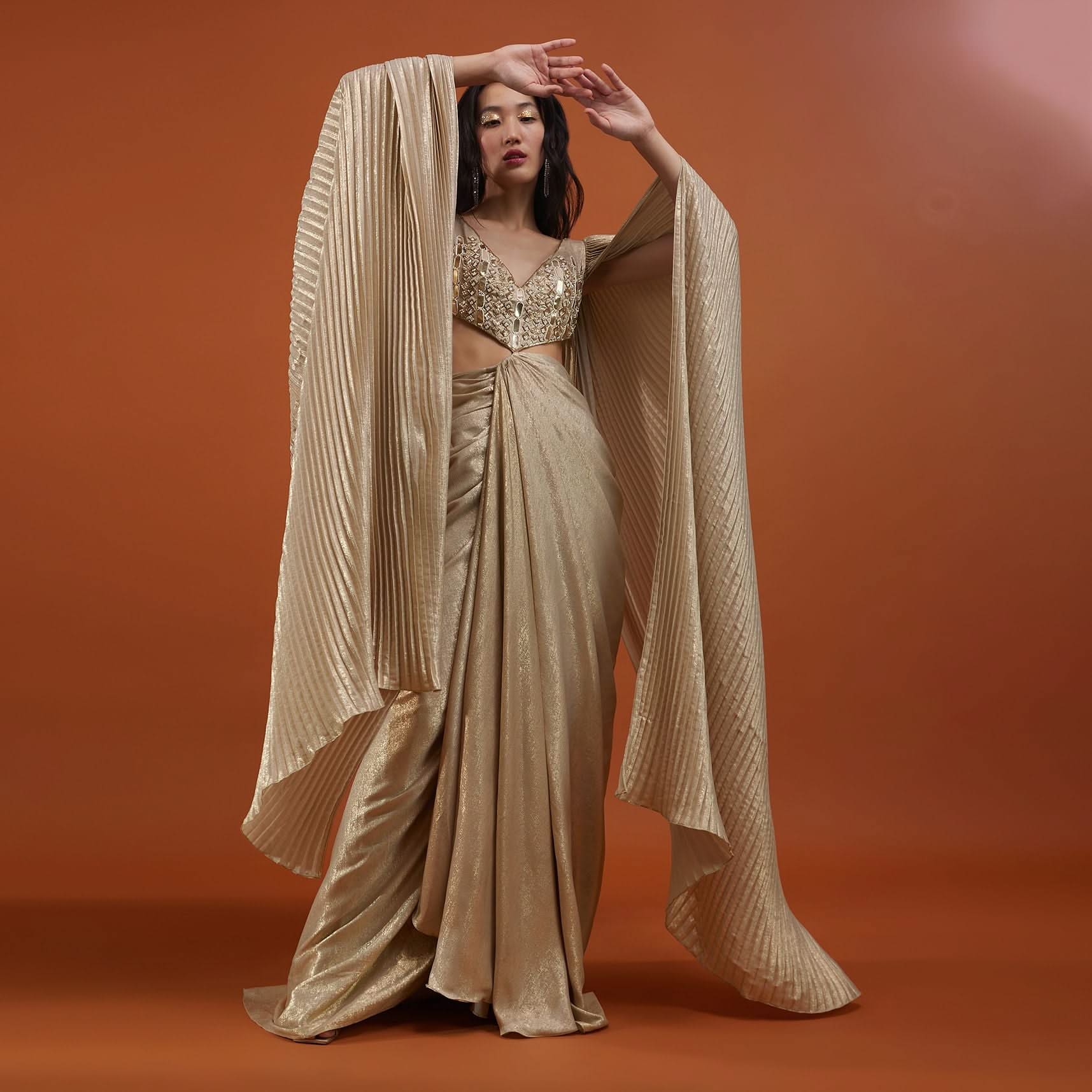 Mocha Brown Gown With A Pre-Pleated Dhoti Skirt And Royal Cape Sleeves - NOOR 2022