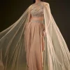 Beige Drape Dhoti Skirt With Embroidered Bustier And Long Cape