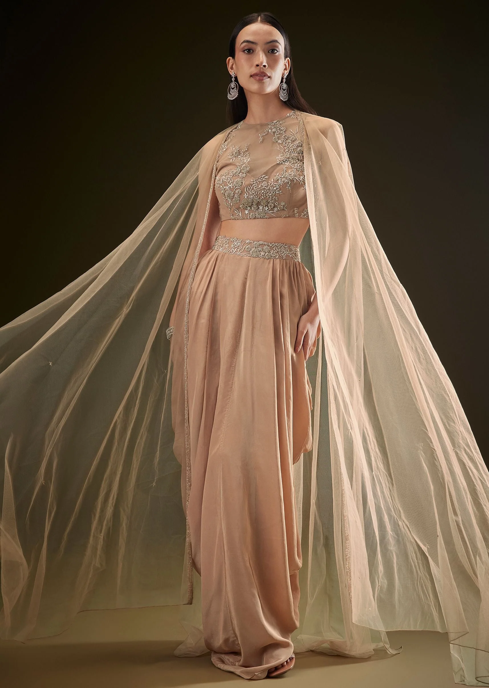 9514-beige-drape-dhoti-skirt-with-embroidered-bustier-and-long-cape-1.webp Beige Drape Dhoti Skirt With Embroidered Bustier And Long Cape